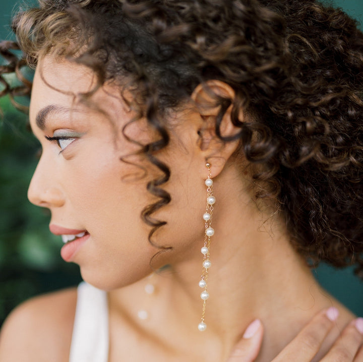 https://www.blairnadeau.com/cdn/shop/products/gold-double-strand-pearl-drop-earrings-for-bride-made-in-toronto.jpg?v=1684983098&width=720